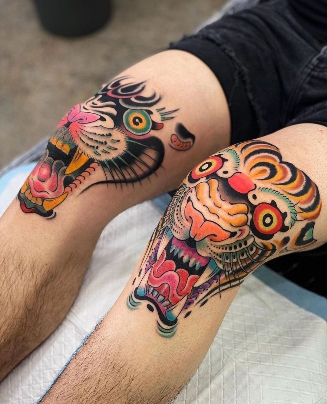 Bold knee tattoos with fierce tiger designs Tattoo Design