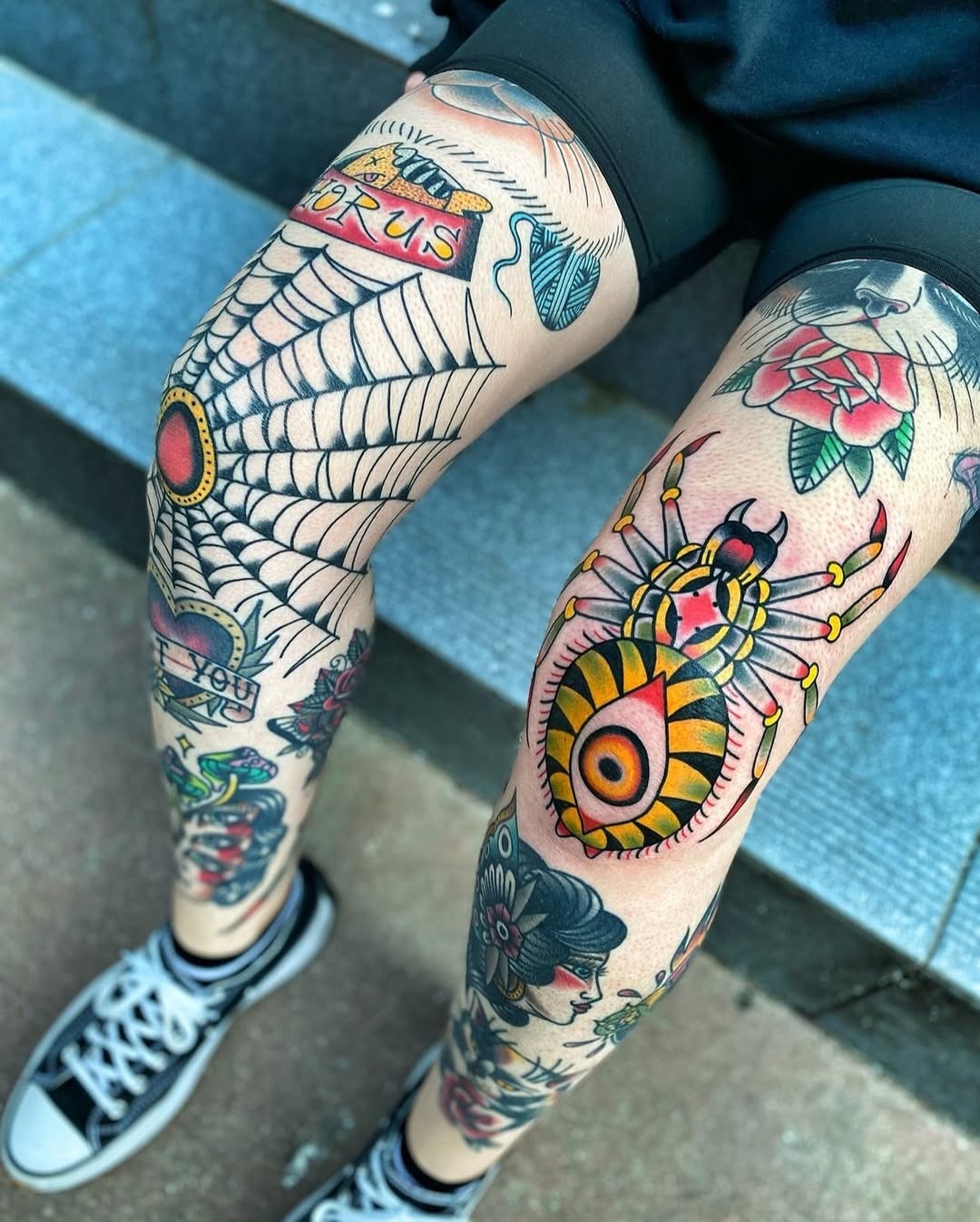Bold knee tattoos with vibrant spider artwork Tattoo Design