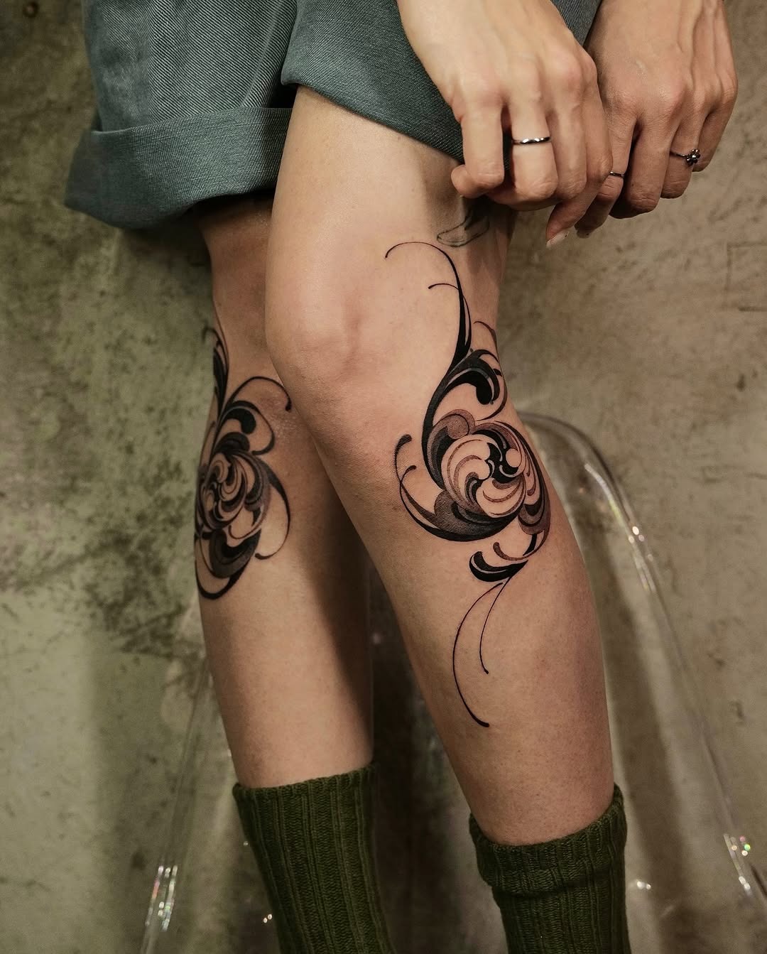 Elegant floral knee tattoo design with swirls Tattoo Design