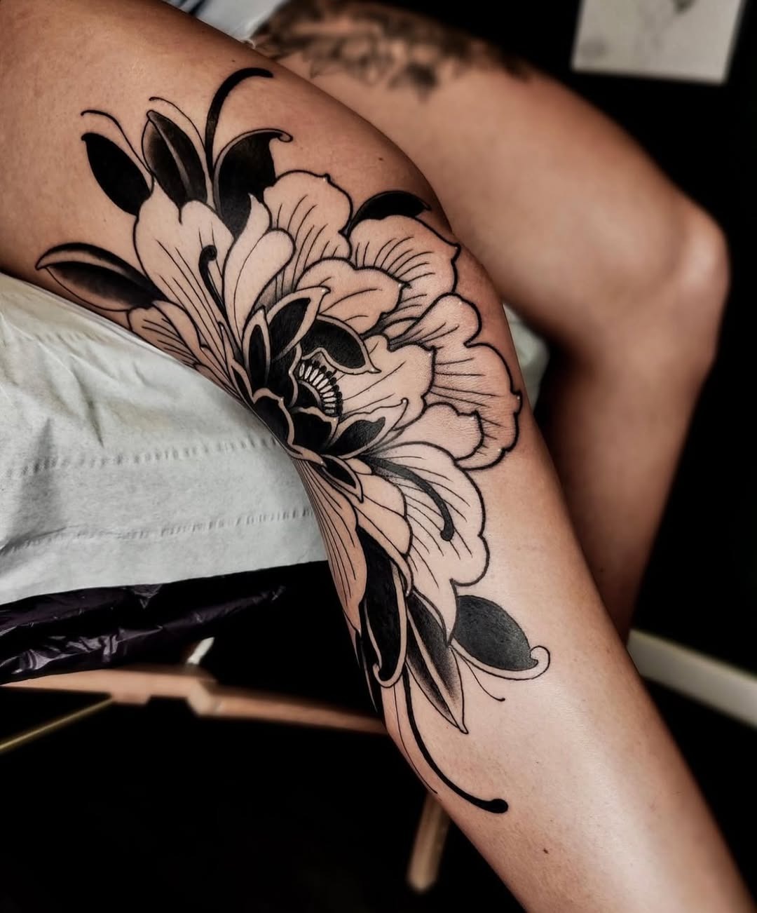Stunning floral knee tattoo design featuring bold lines Tattoo Design