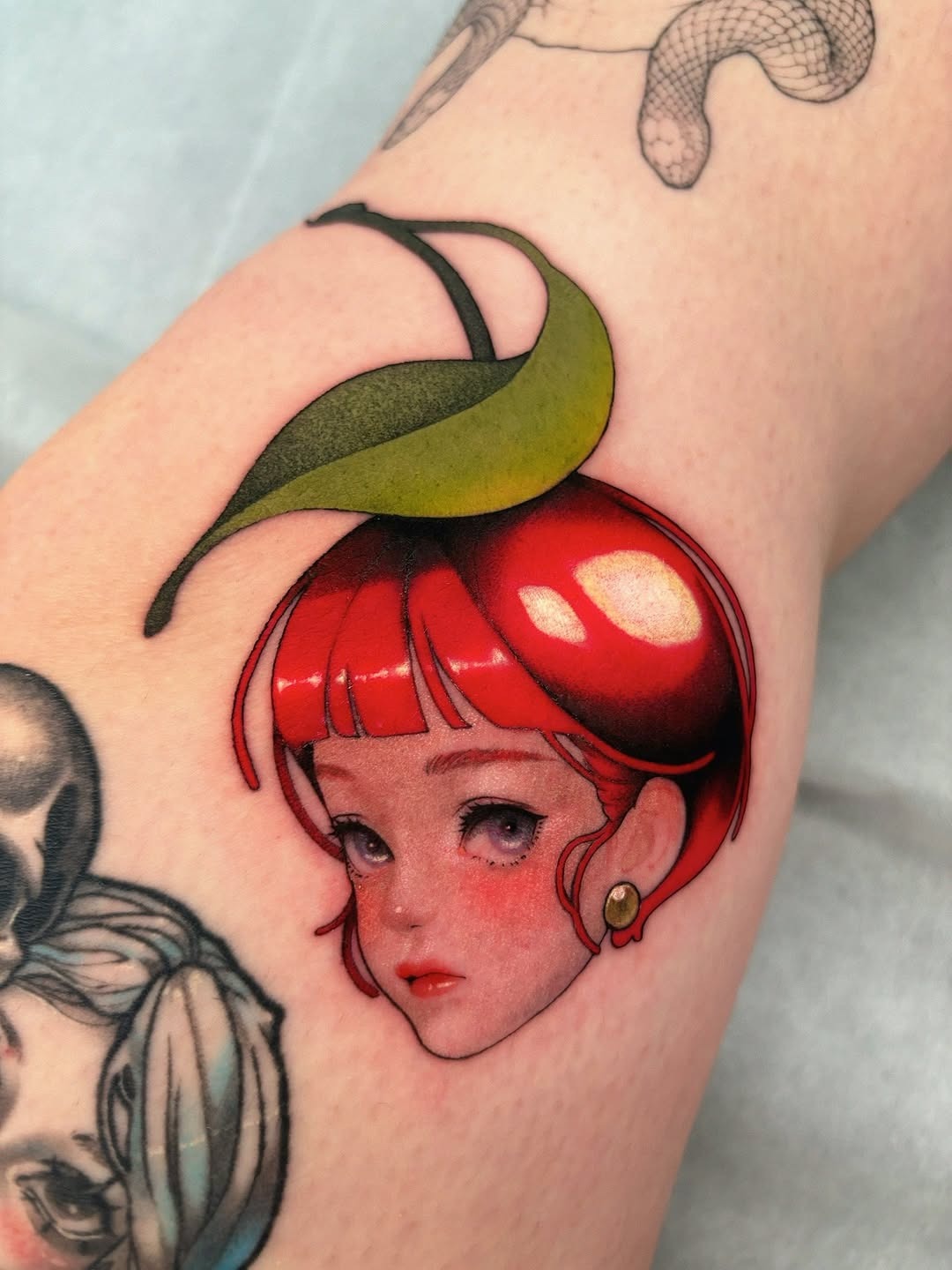 Vibrant Cherry-Headed Girl Knee Tattoo Tattoo Design
