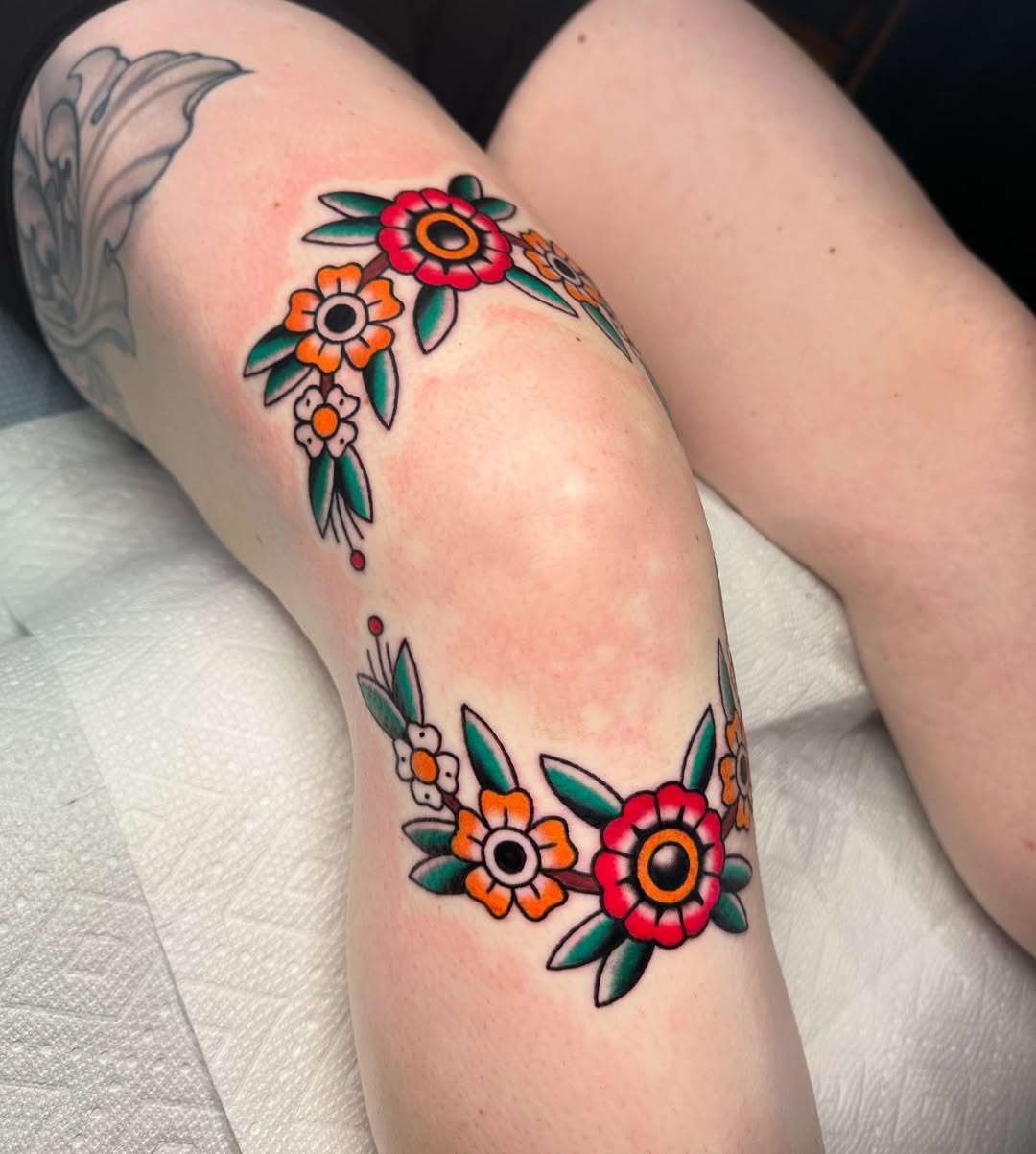 Vibrant Floral Design Wrapping the Knee Tattoo Design
