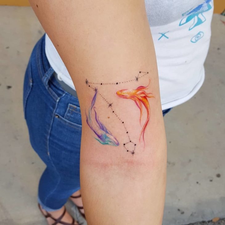Blue and Orange Fish Around Pisces Constellation Tattoo Design