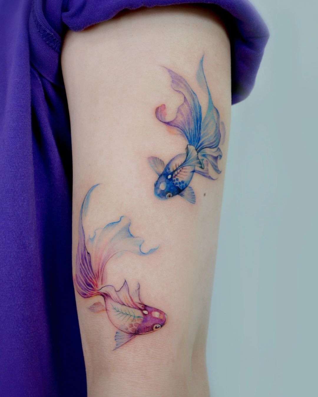 Blue Goldfish and Red Goldfish in a Pond Tattoo Design