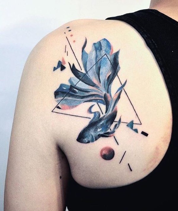 Long Finned Fish Swimming Through Triangle Tattoo Design
