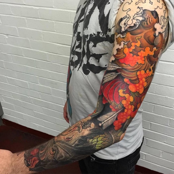 Red Koi with Arrows and Mask Tattoo Design