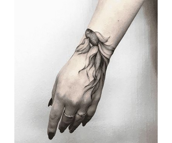 Small Monochrome Goldfish on Wrist Tattoo Design