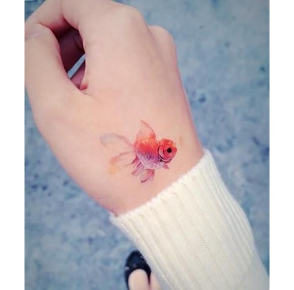 Tiny Lionhead Goldfish on Hand Tattoo Design