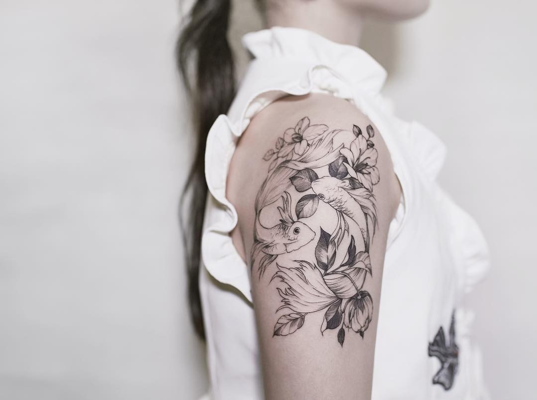 Two Swirling Goldfish and Flowers Tattoo Design