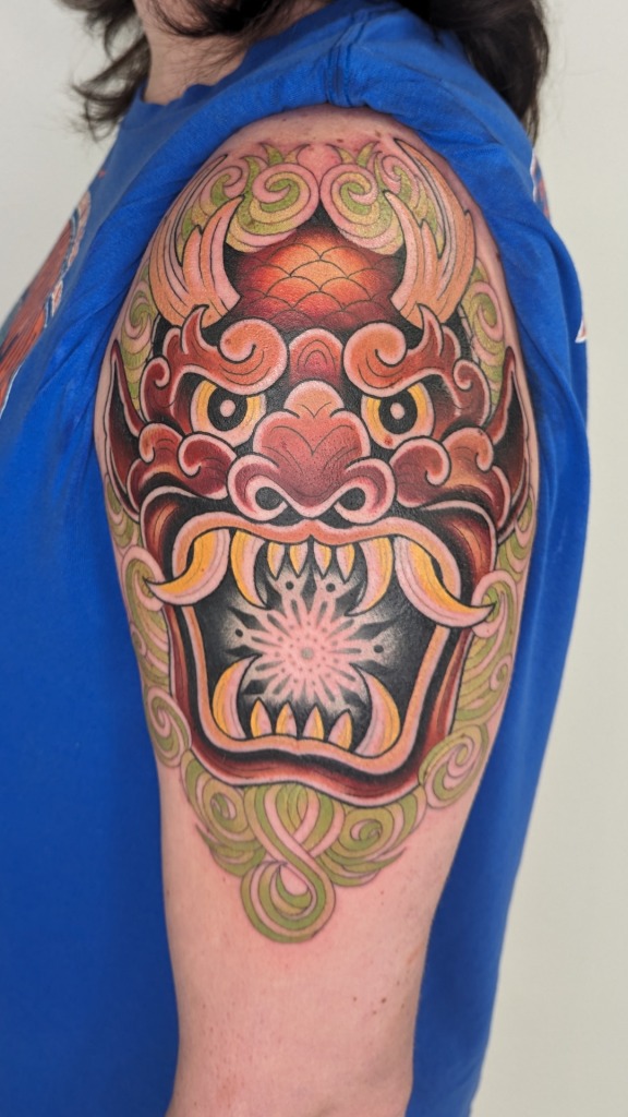 Bold Oni Mask: A Striking Shoulder Design Tattoo Design