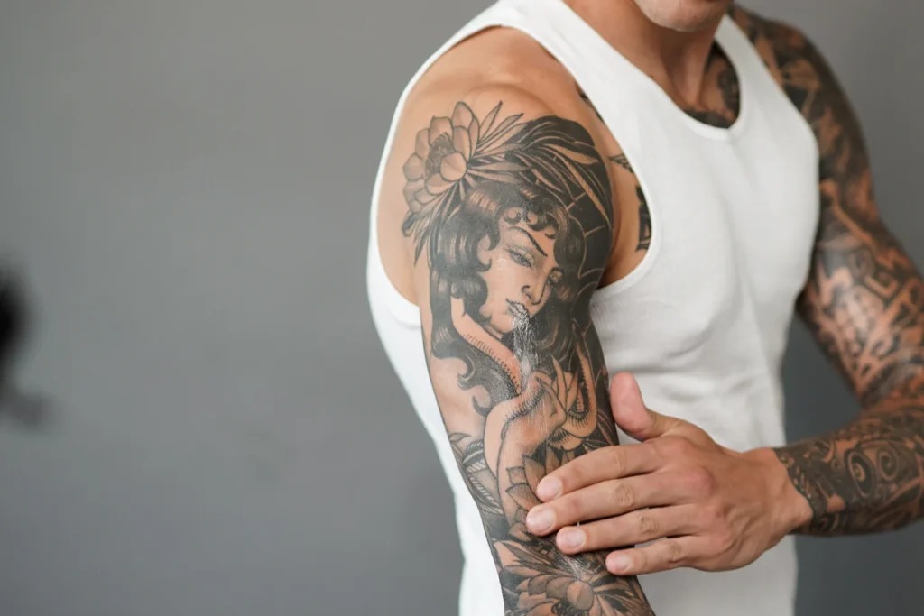 Feminine Elegance: A Delicate Black and Gray Portrait Tattoo Design