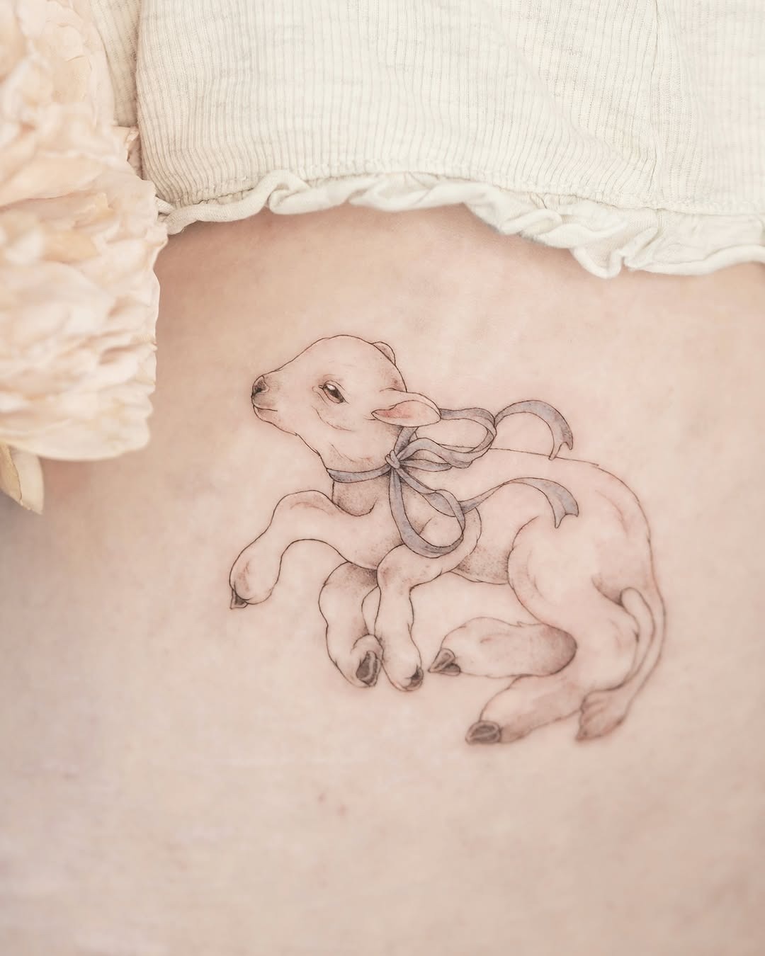 Adorable lamb tattoo displaying grace and charm Tattoo Design