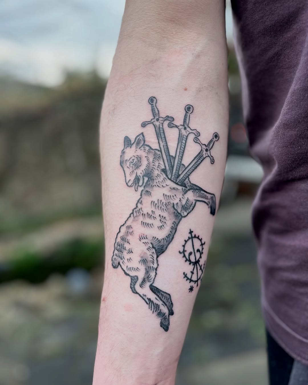 Artistic lamb tattoo with sword symbolism Tattoo Design
