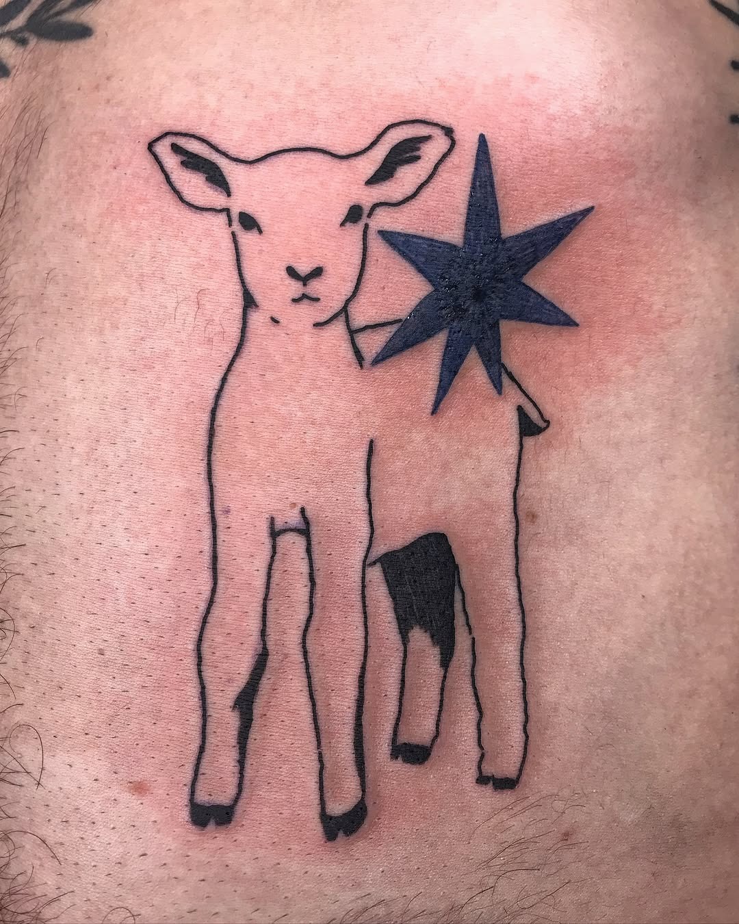 Charming lamb tattoo with striking star element Tattoo Design