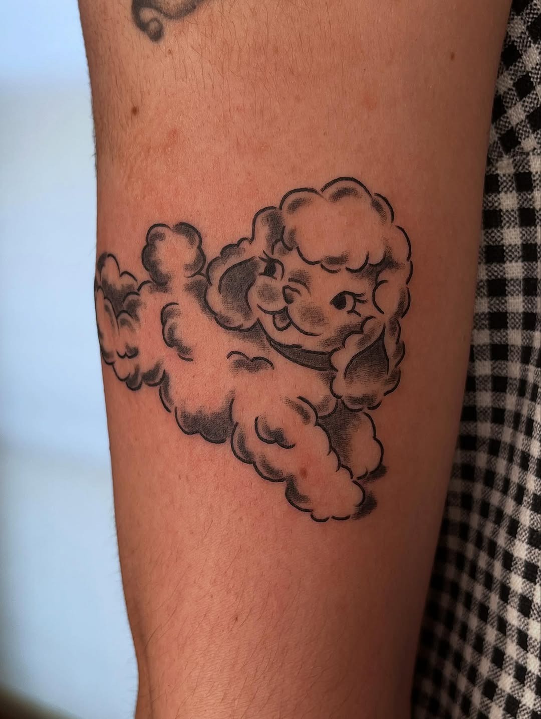 Playful lamb tattoo with cloudy vibes Tattoo Design