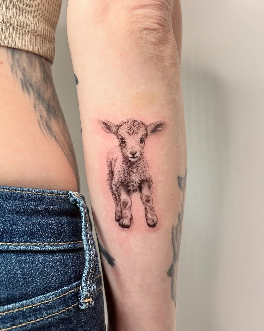 Whimsical lamb tattoo with playful energy Tattoo Design