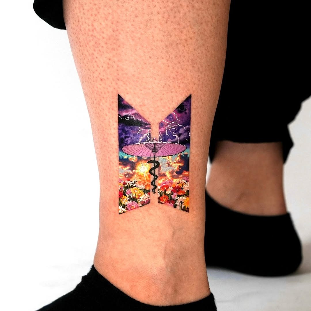 Bold butterfly landscape tattoo on calf Tattoo Design
