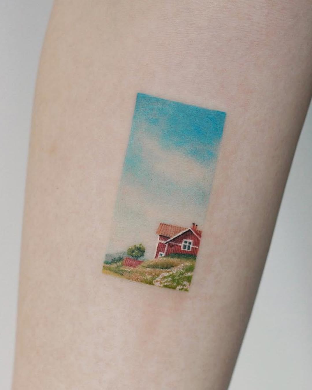Charming countryside landscape tattoo on arm Tattoo Design
