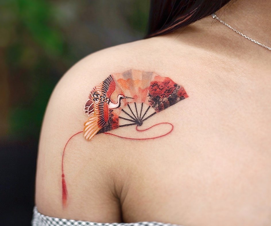 Elegant crane tattoo with vibrant fan design Tattoo Design