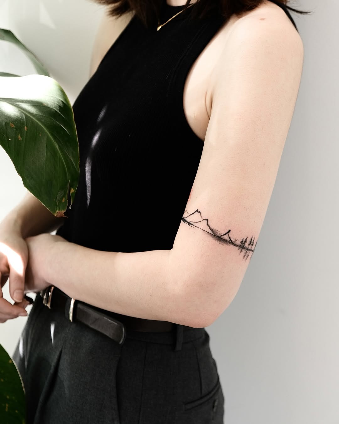 Elegant minimalist landscape tattoo on the arm Tattoo Design