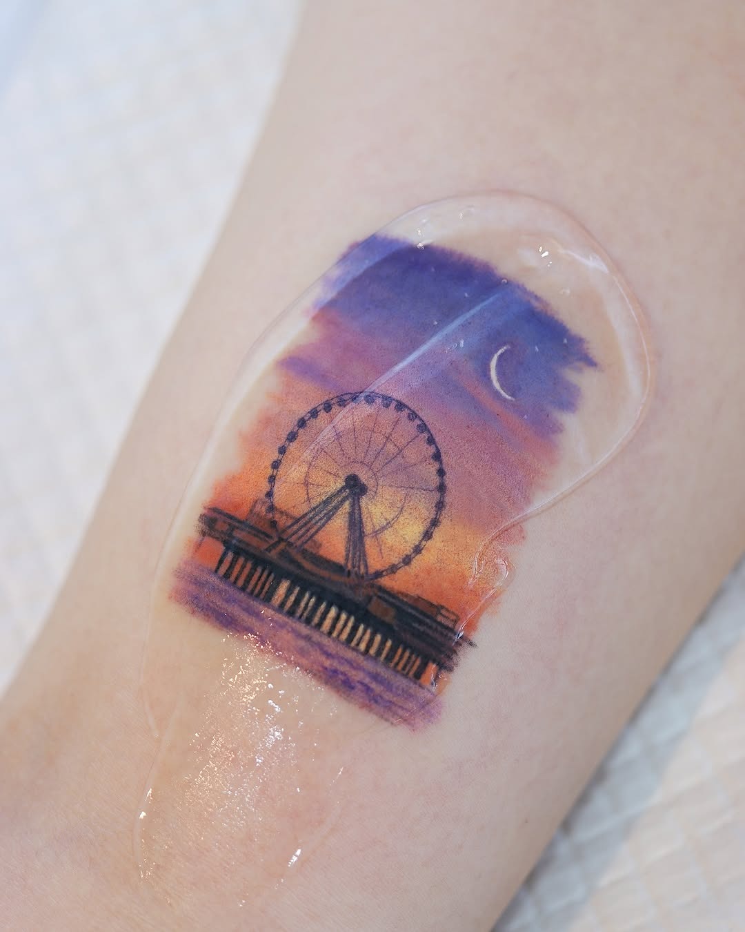 Serene Ferris wheel tattoo at sunset Tattoo Design