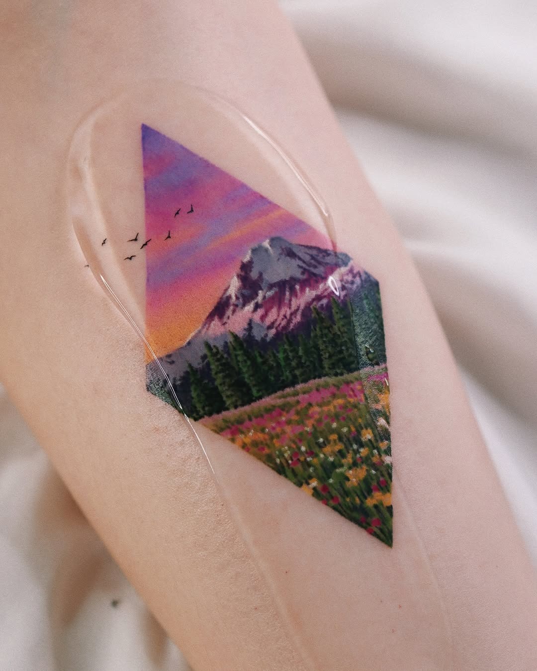 Stunning geometric landscape tattoo with vibrant colors Tattoo Design