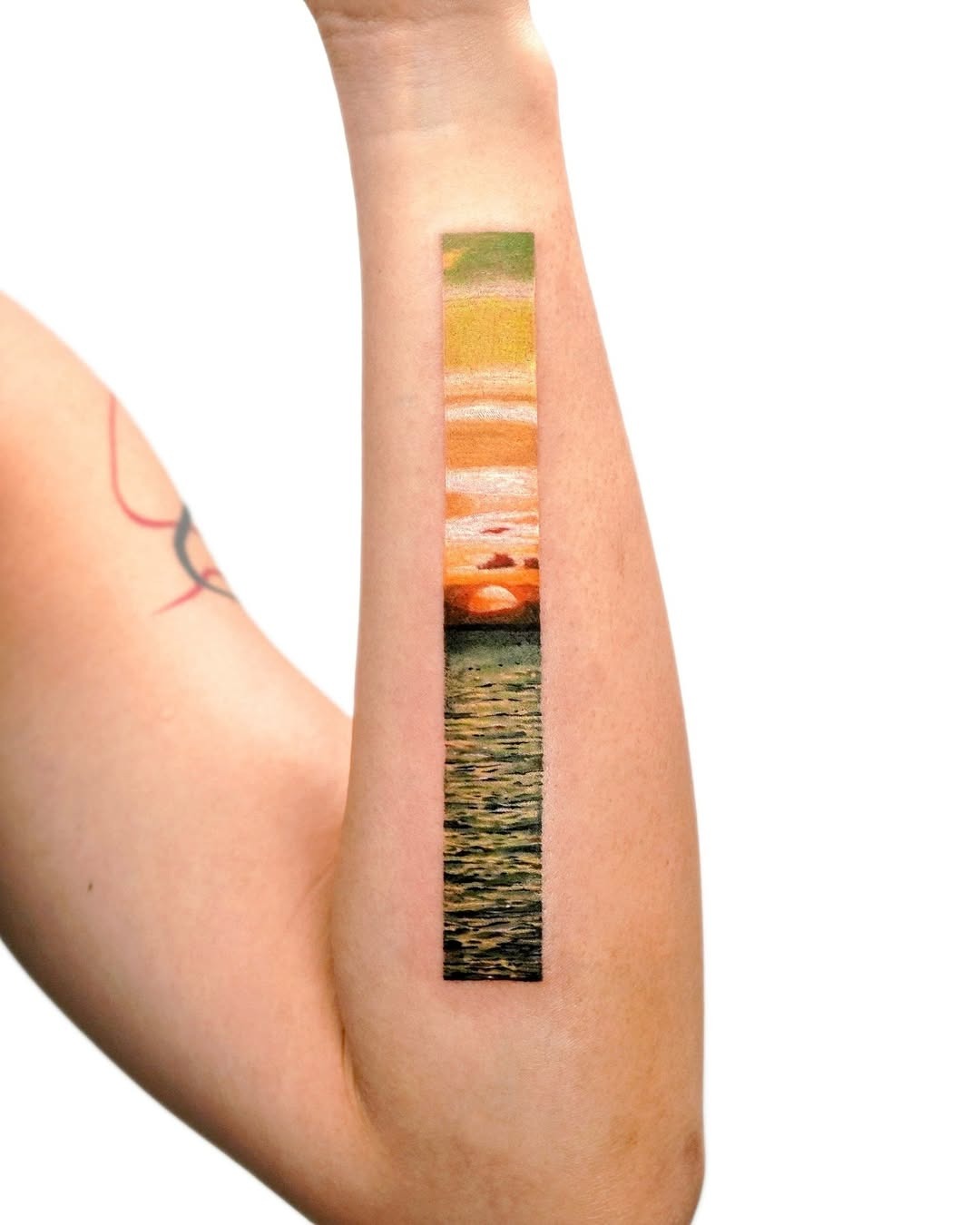 Stunning sunset landscape tattoo on forearm Tattoo Design