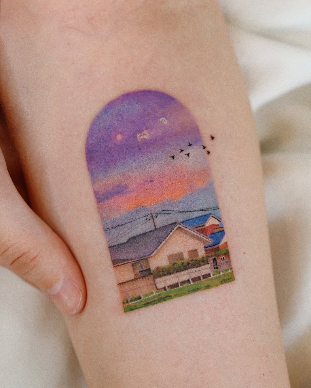 Vibrant sunset tattoo with serene landscape details Tattoo Design