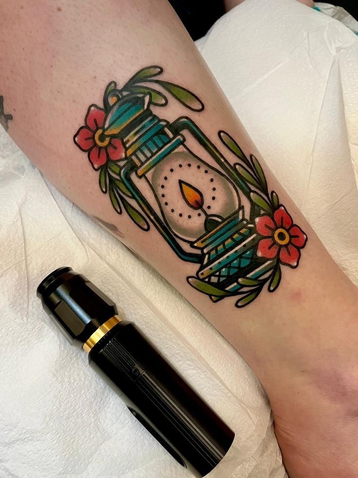 Green Camping Lantern with Floral Twist Tattoo Design