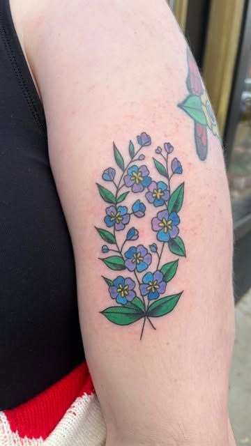 Blue larkspur with a tiny bee for a playful twist Tattoo Design