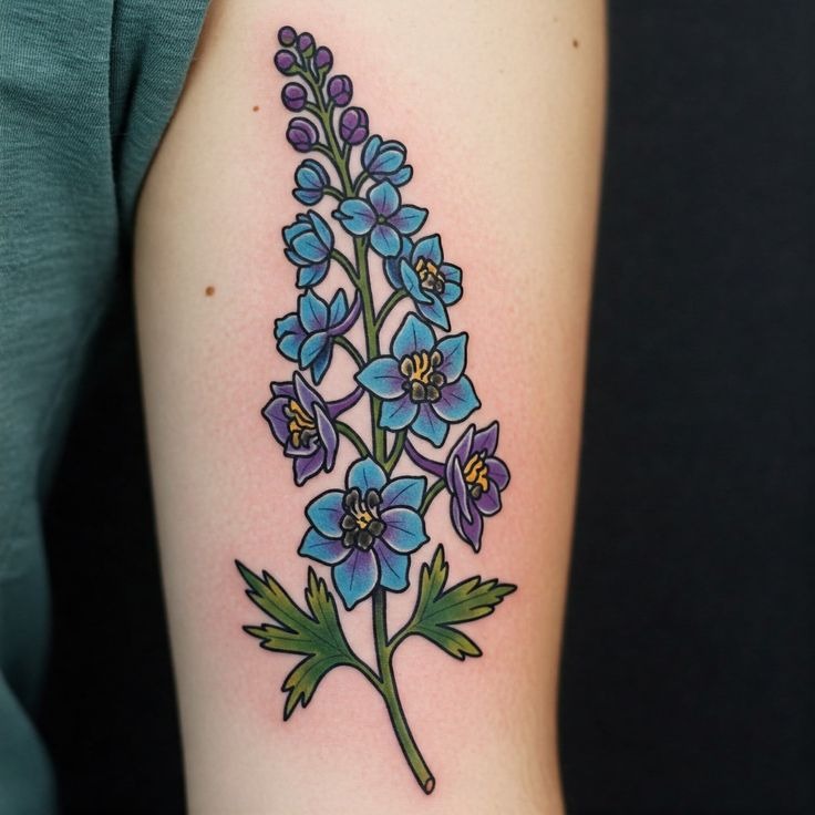 Larkspur cluster with script for a personal tribute Tattoo Design