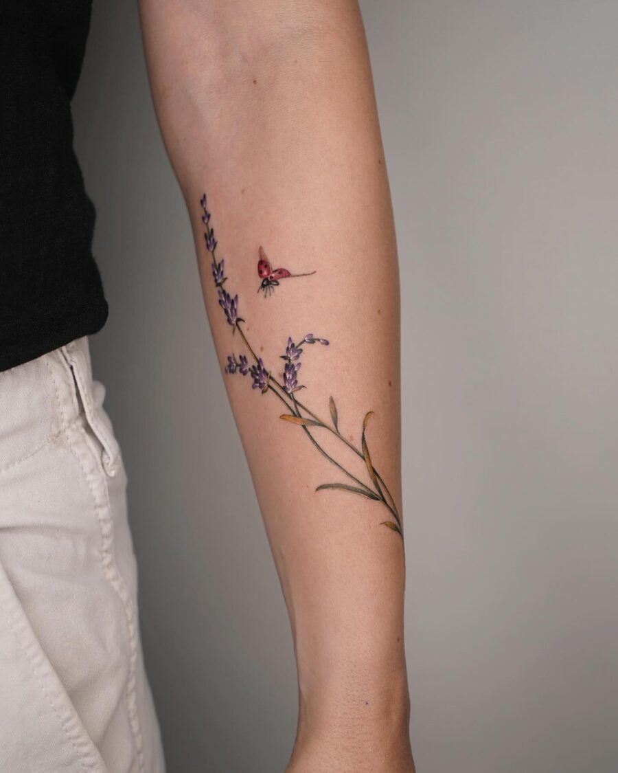 Delicate lavender tattoo with a butterfly accent Tattoo Design