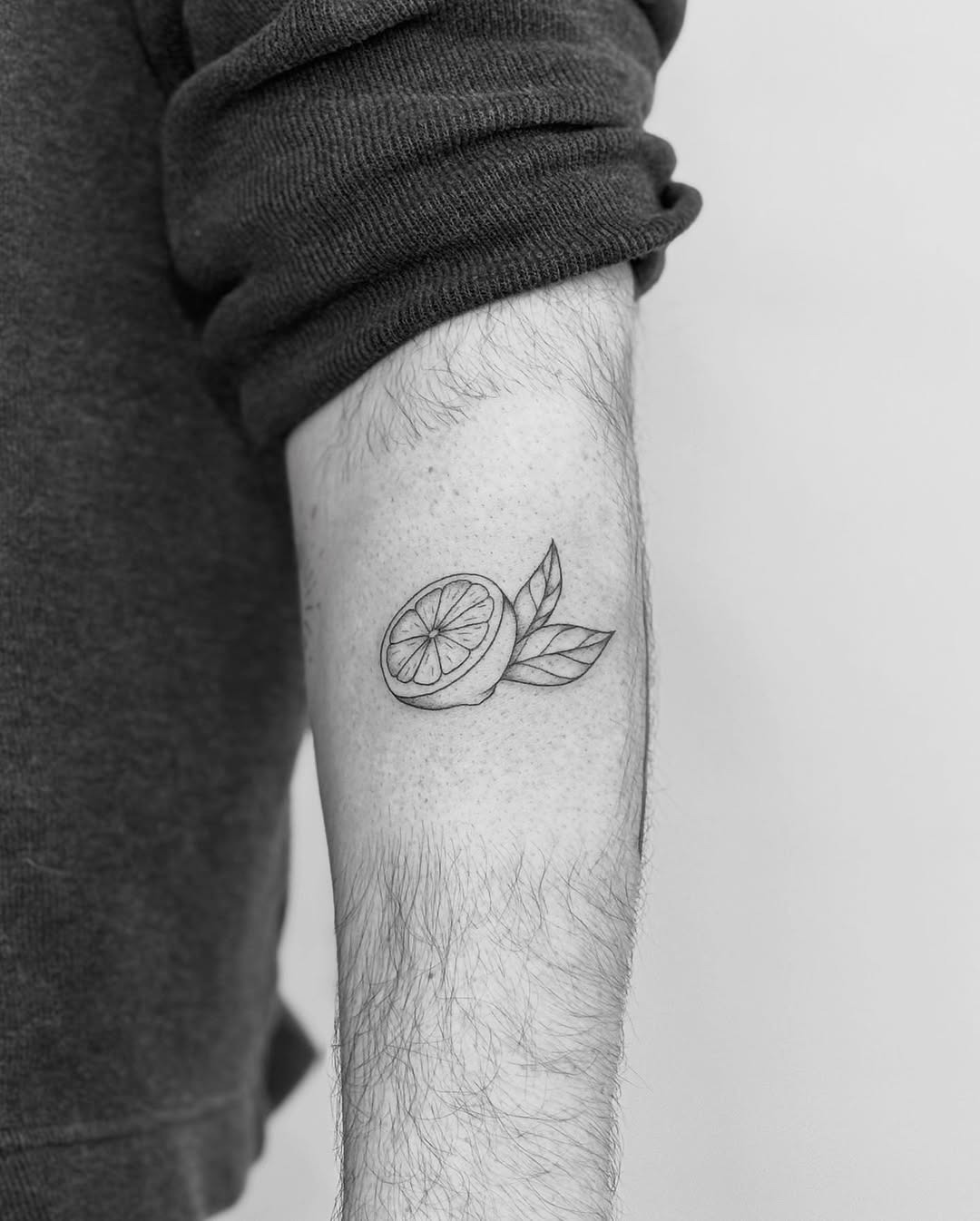 Charming black and white lemon tattoo design Tattoo Design