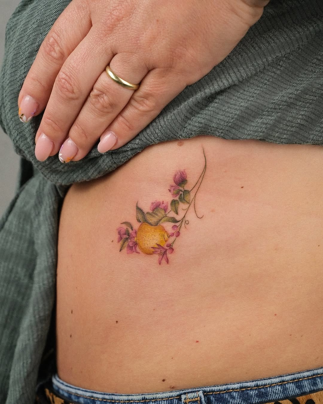 Charming lemon tattoo with floral elements Tattoo Design