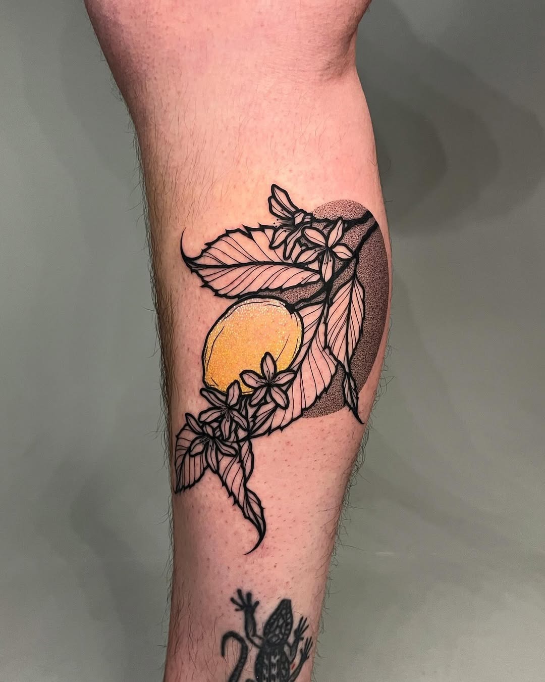 Elegant lemon tattoo with floral accents Tattoo Design