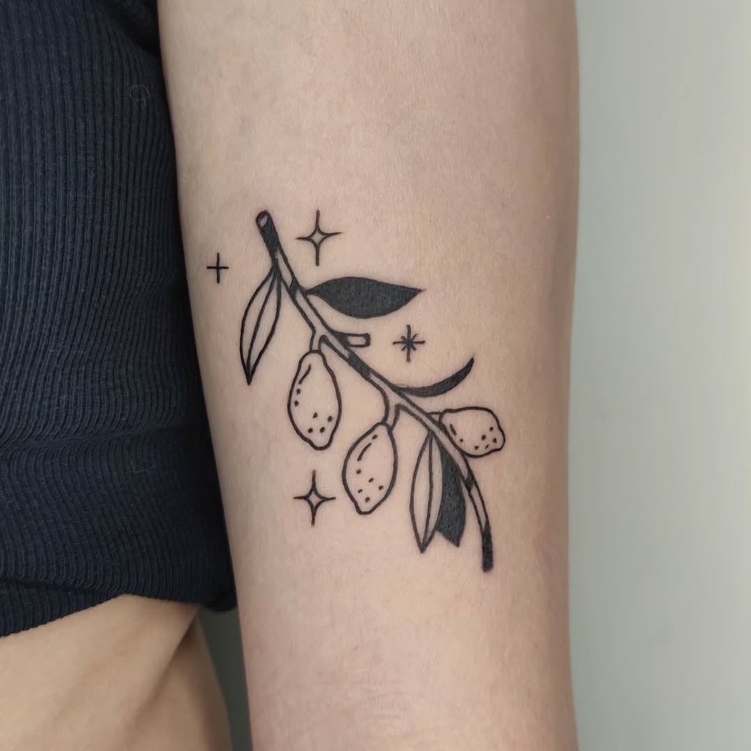 Minimalist lemon branch tattoo with delicate leaves Tattoo Design