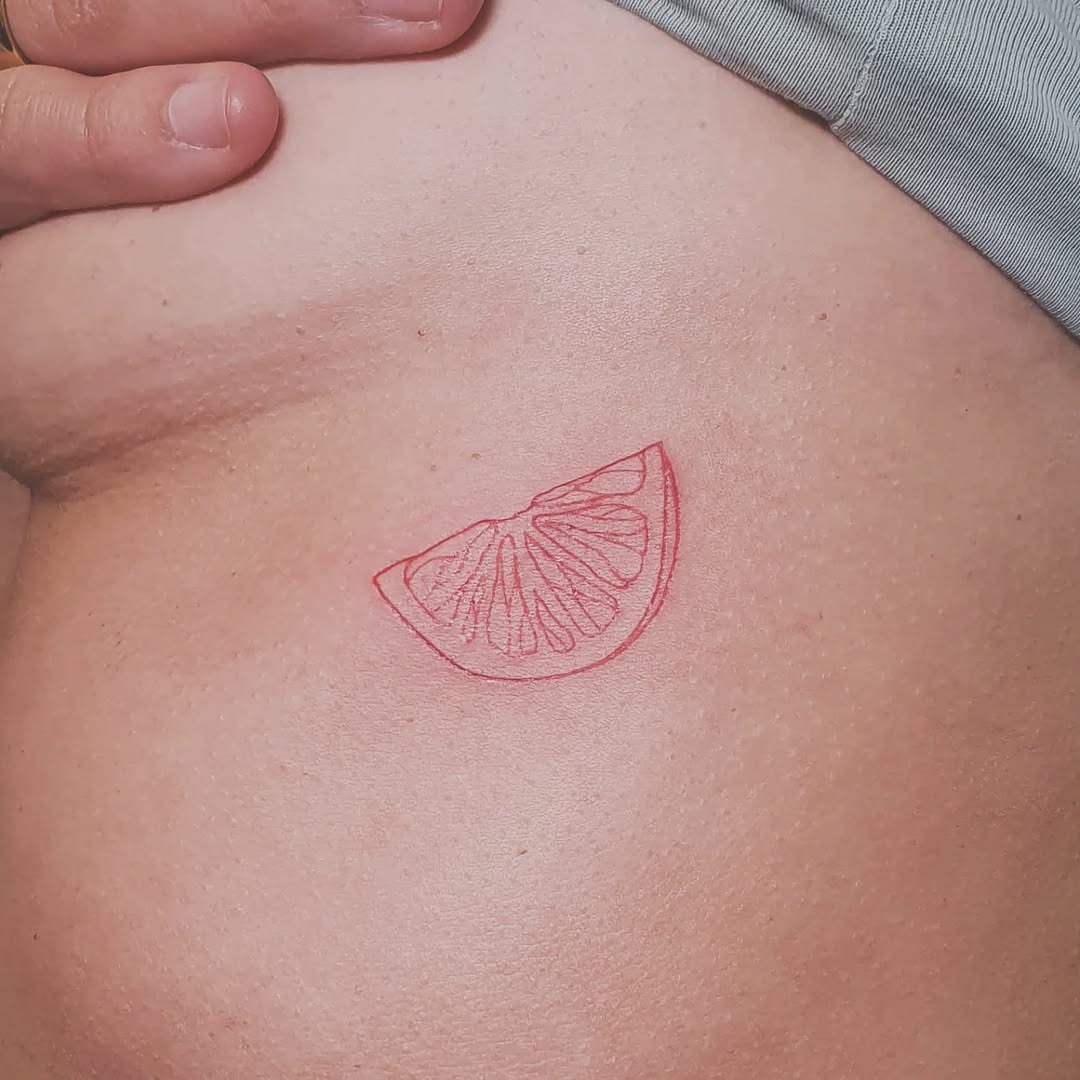 Playful Red Lemon Slice Tattoo Design Tattoo Design