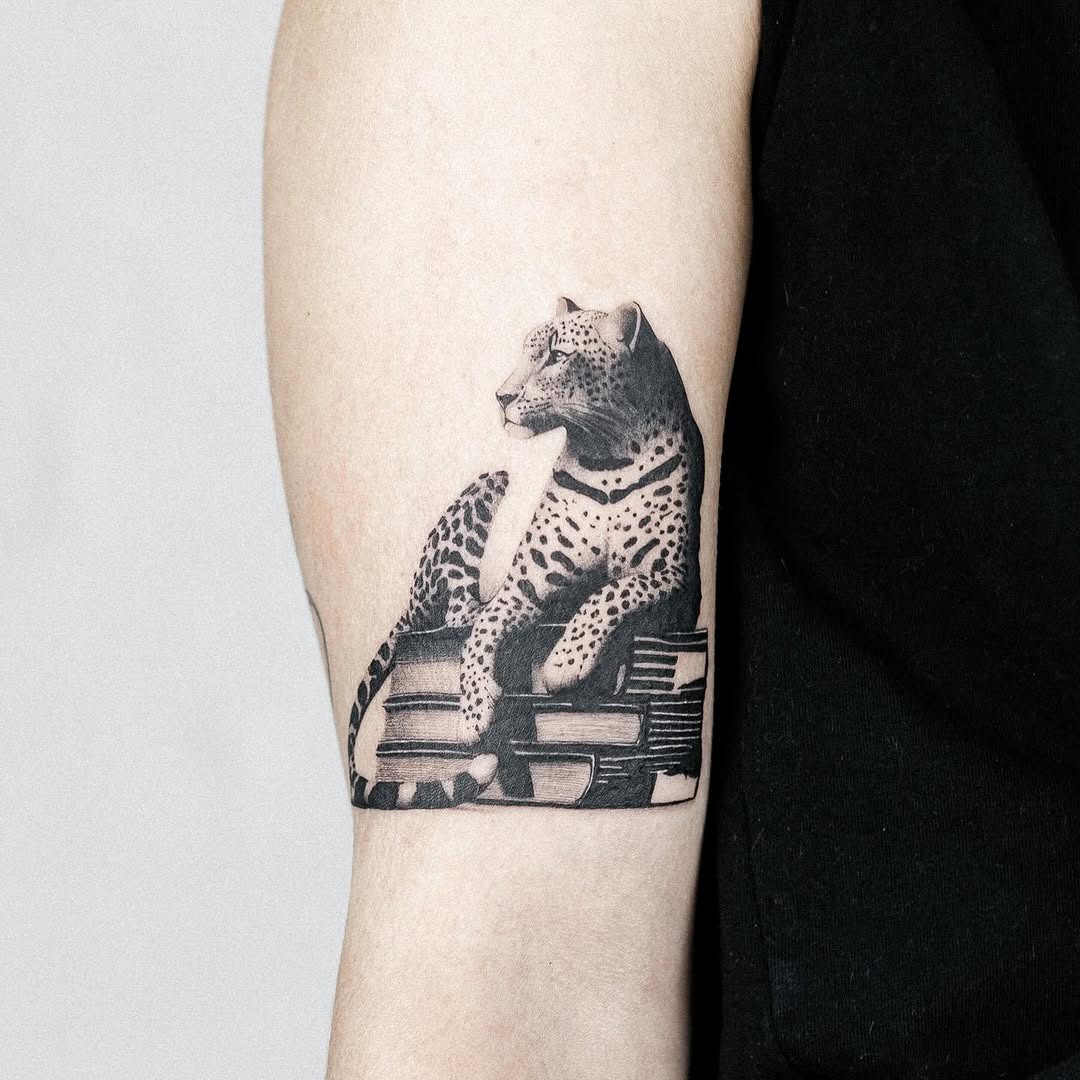 A Leopard Tattoo with Books Design Inspiration Tattoo Design