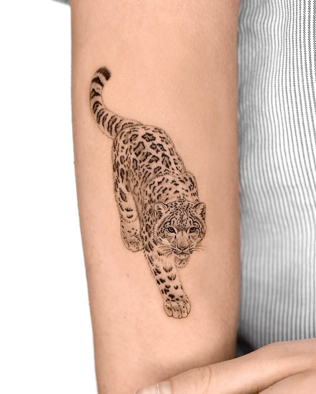 Dynamic leopard tattoo showcasing fierce elegance Tattoo Design