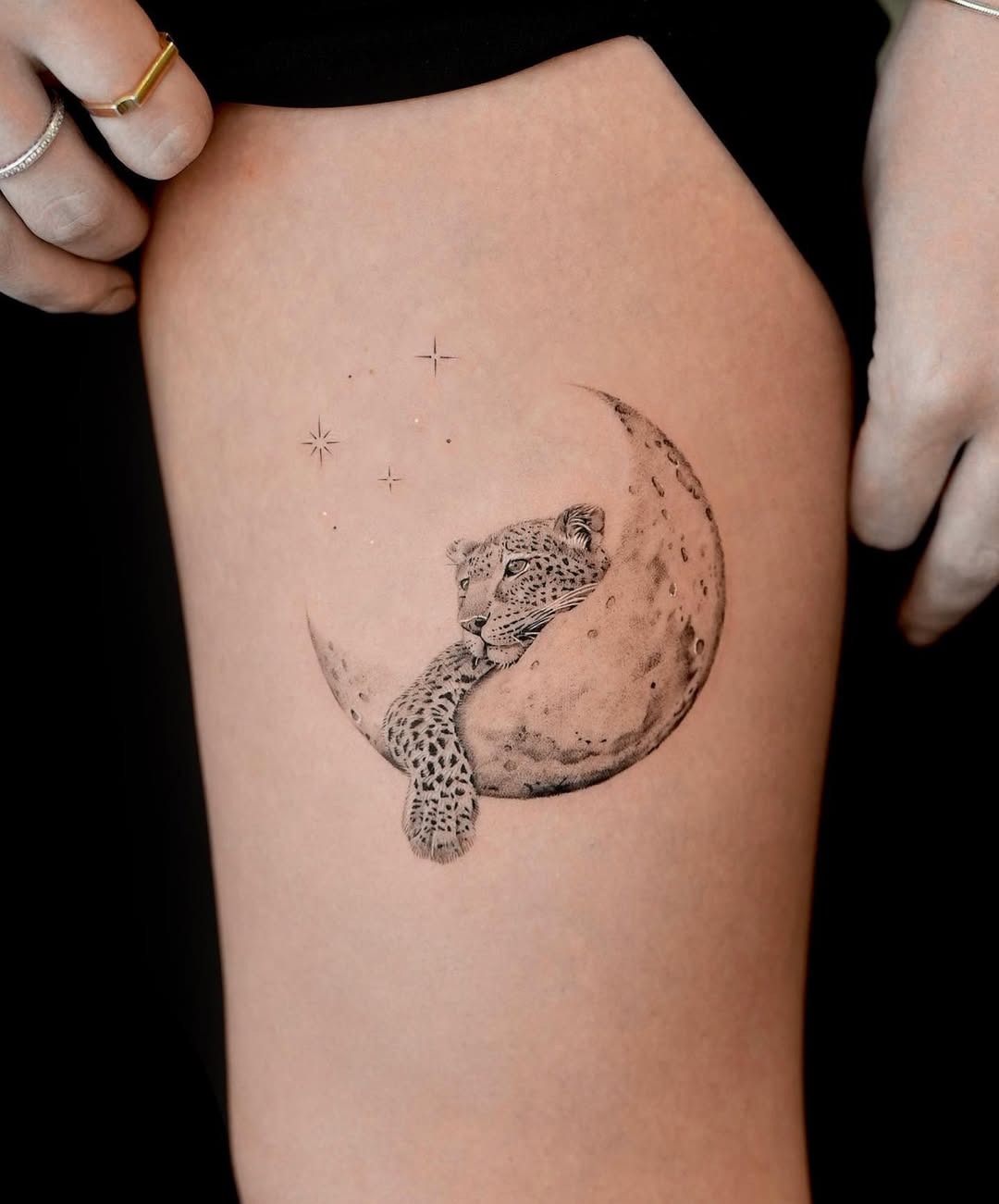 Elegant leopard resting on a crescent moon Tattoo Design
