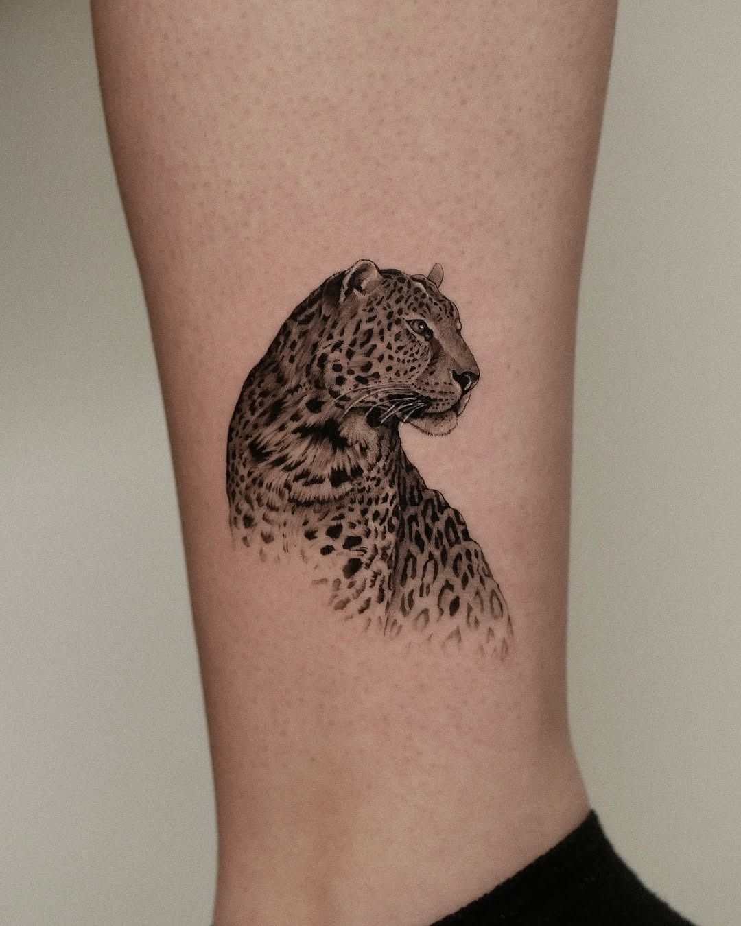 Elegant leopard tattoo showcasing fierce beauty Tattoo Design