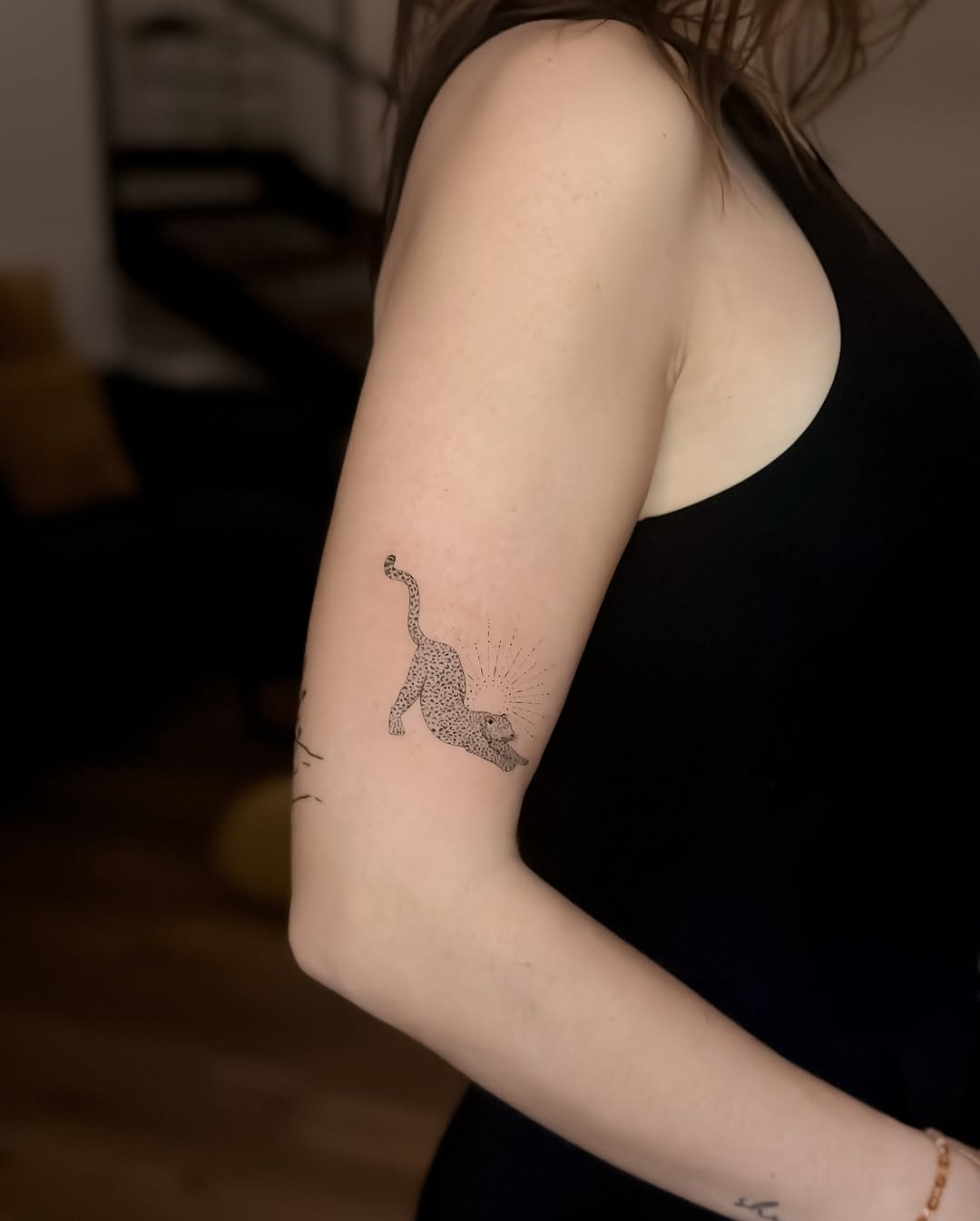 Minimalist leopard tattoo exudes stealthy elegance Tattoo Design