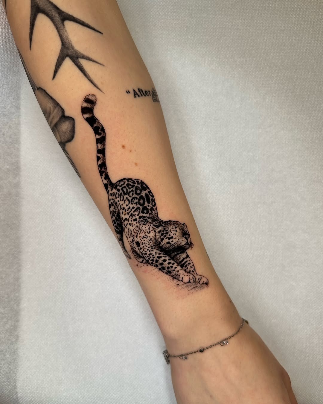 Playful leopard tattoo showcasing feline grace Tattoo Design