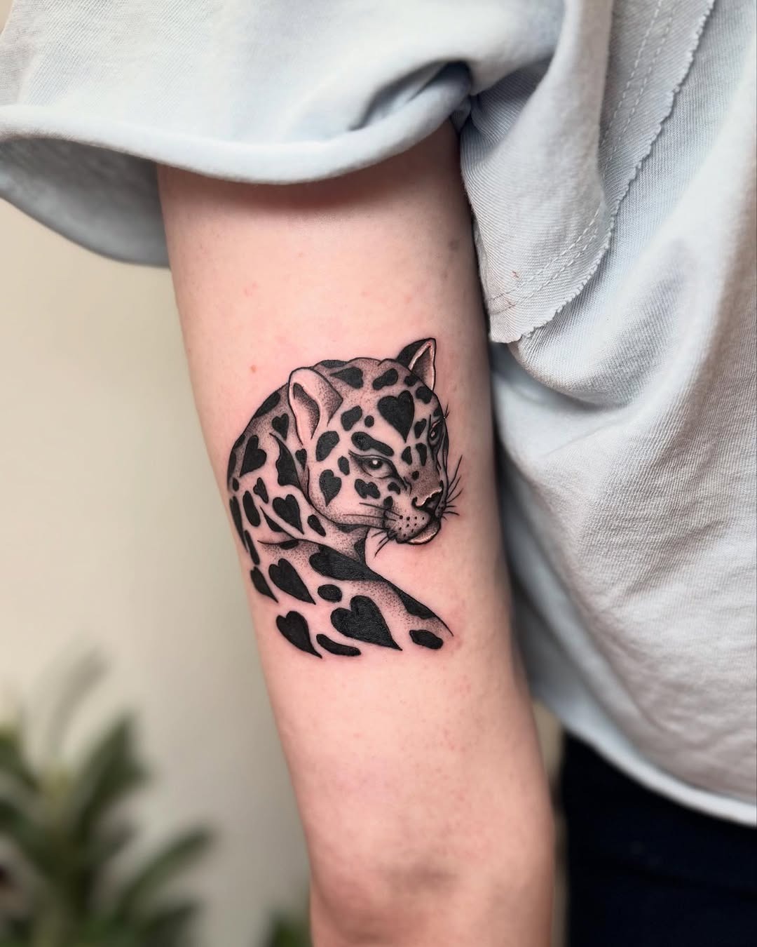 Realistic leopard tattoo design on arm Tattoo Design
