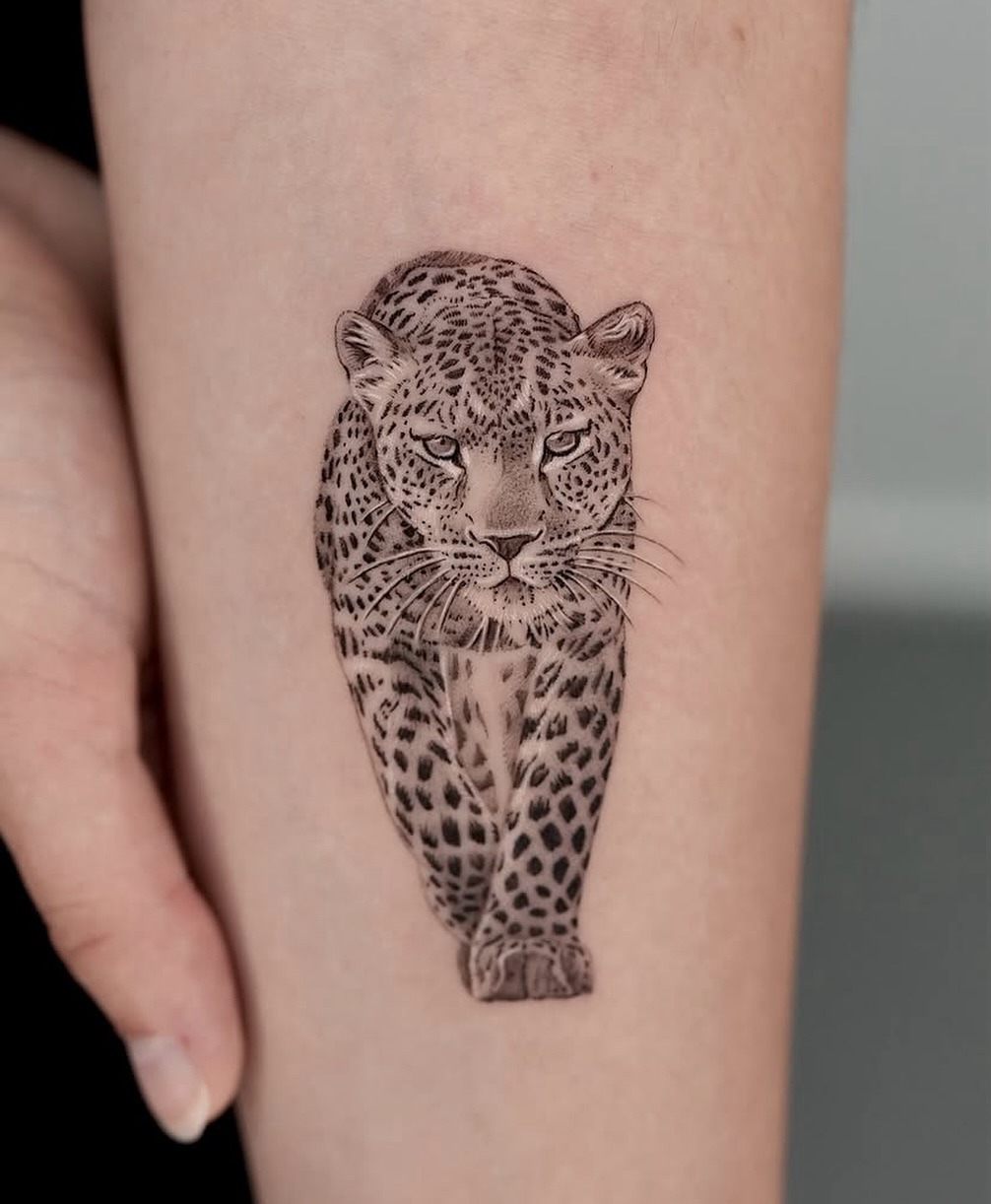 Realistic leopard tattoo showcasing fierce elegance Tattoo Design