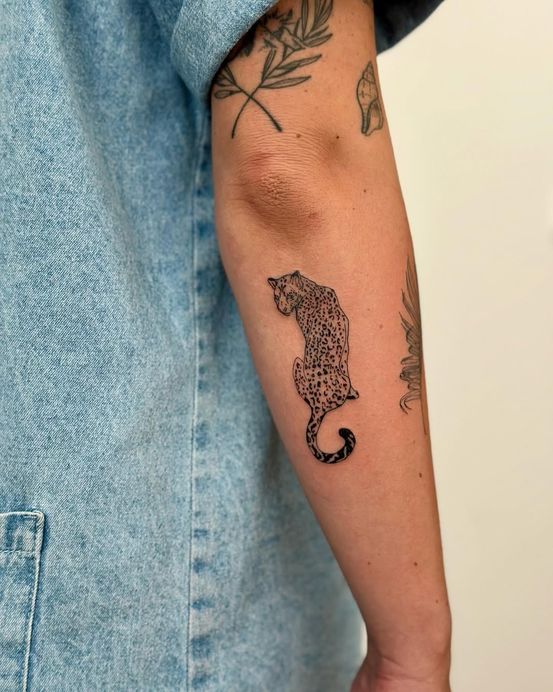Stylish leopard tattoo on a forearm Tattoo Design