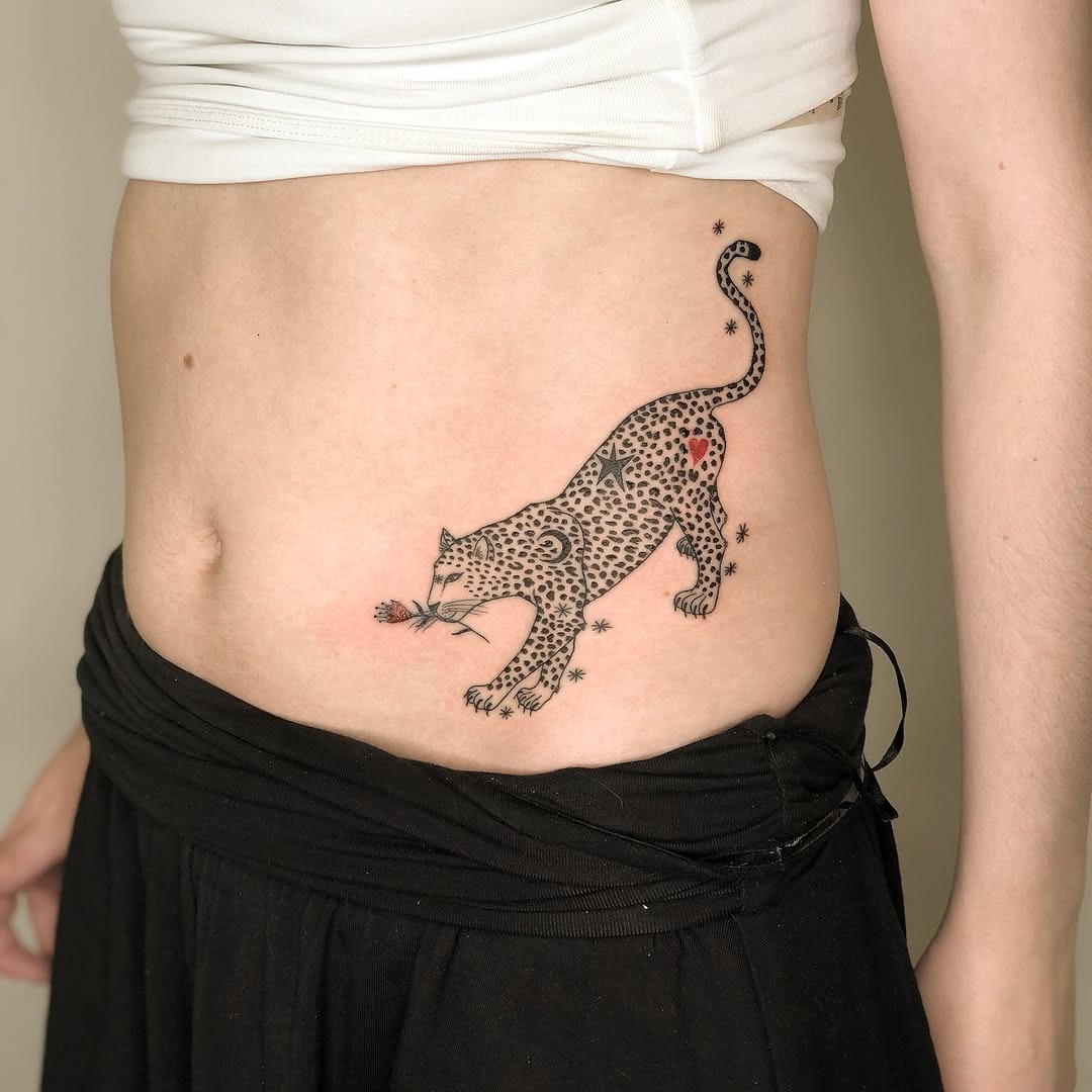Stylish leopard tattoo with floral accents Tattoo Design