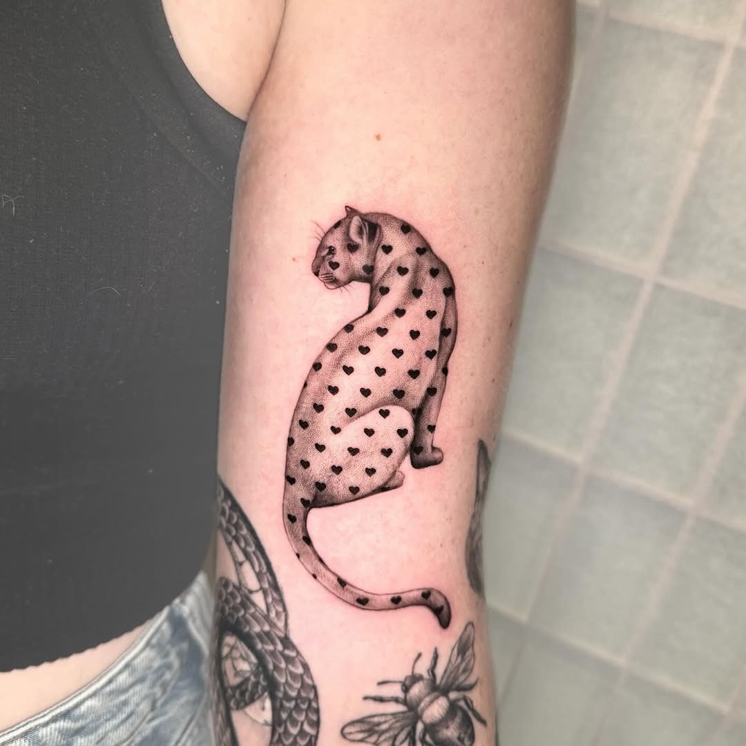 Stylish leopard tattoo with heart motifs Tattoo Design