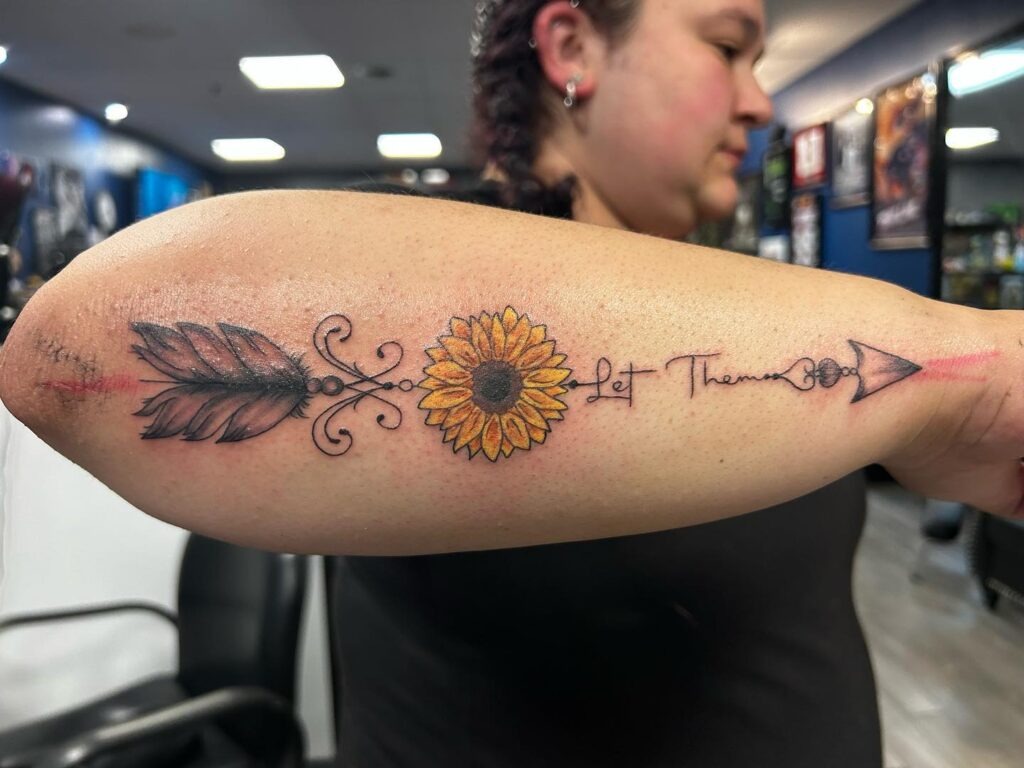 Let Them Go Tattoo with Sunflower, Feather, and Arrow Tattoo Design