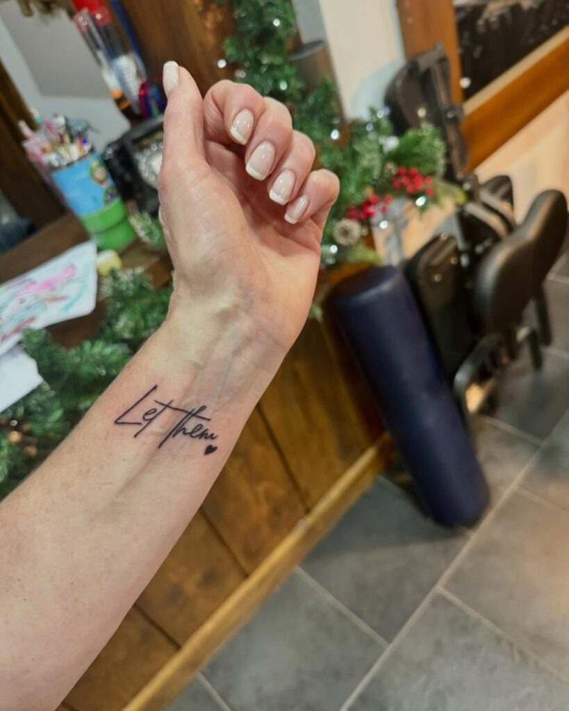 Let Them Wrist Tattoo with Solid Black Heart Tattoo Design